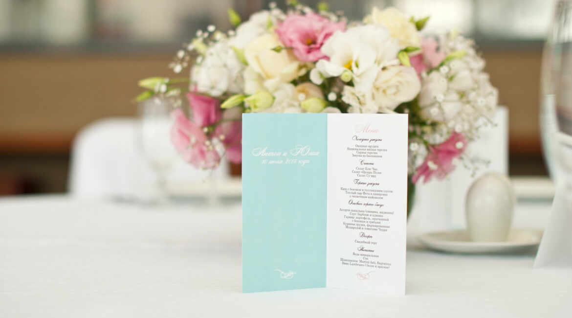 Menu card with beautiful flowers on table in wedding day at Lakeside Weddings